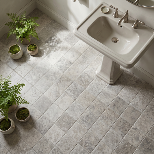 Silver travertine tumbled 4x4 tile - powder room floor