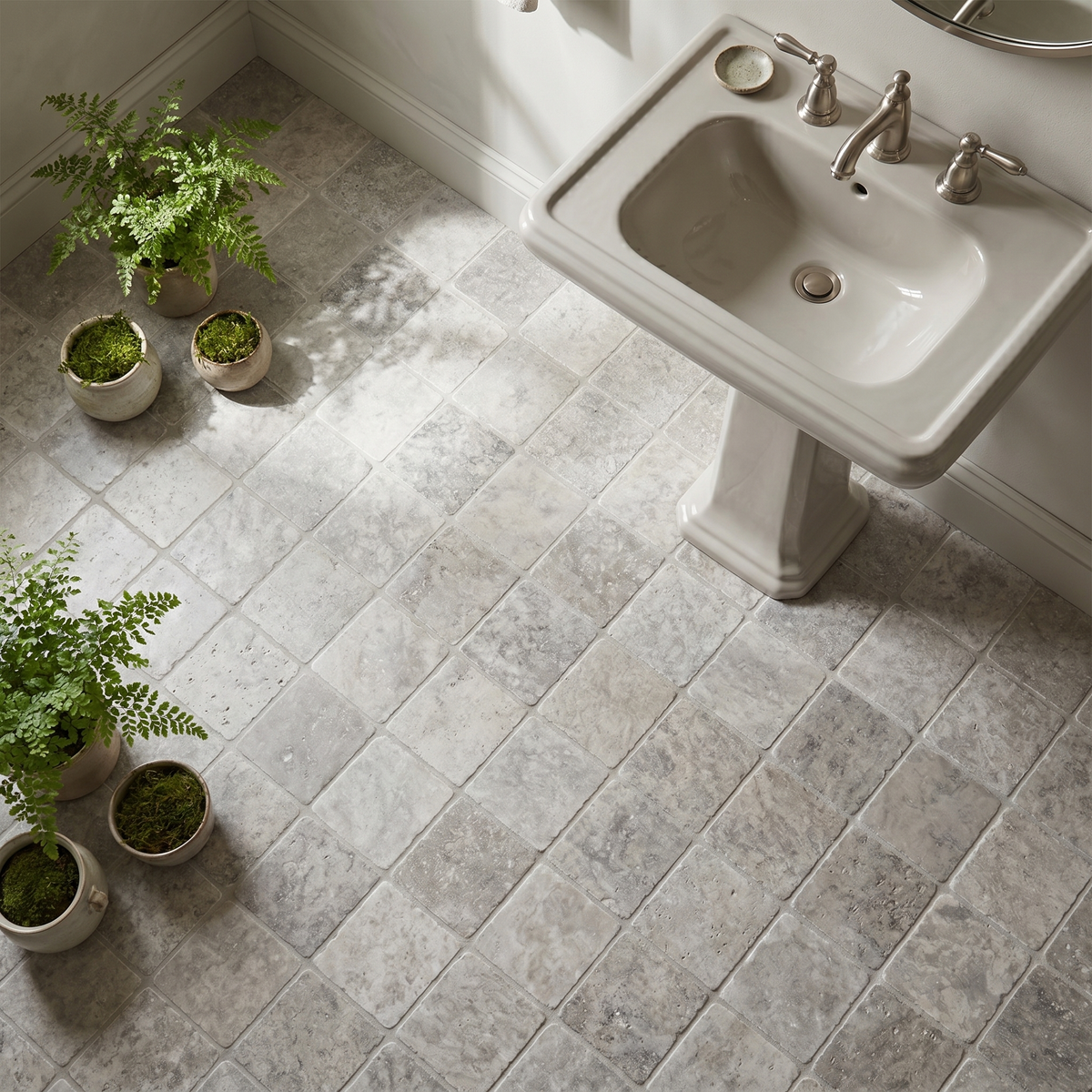 Silver travertine tumbled 4x4 tile - powder room floor