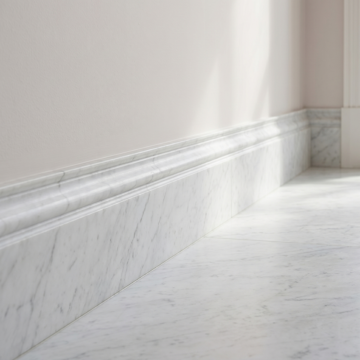 White Carrara honed marble base molding - hallway skirting