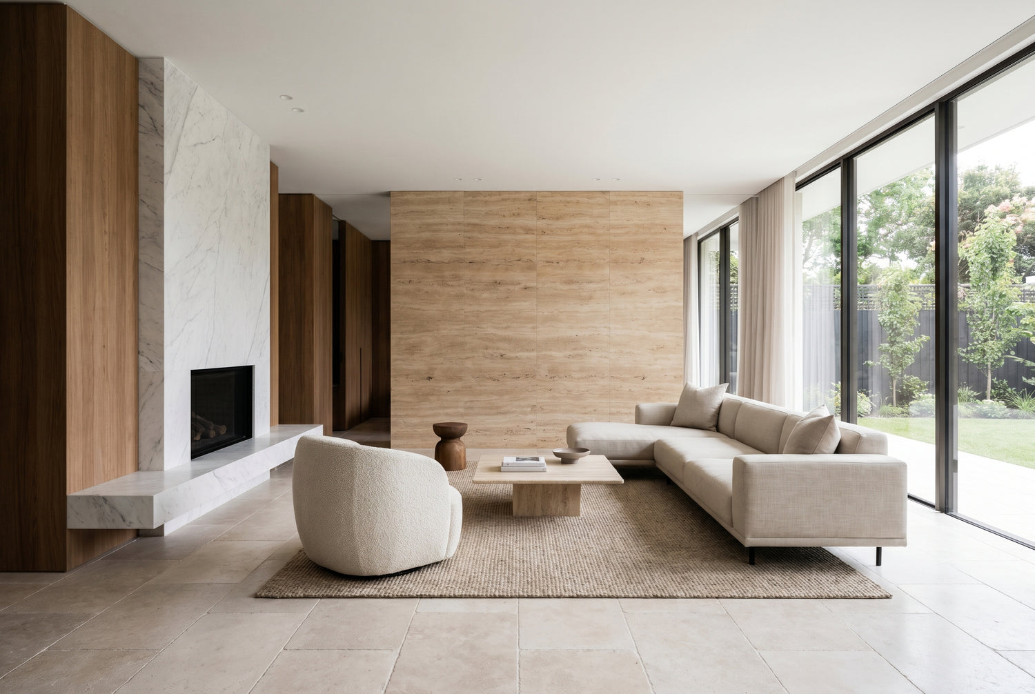 Upscale living room with travertine and marble