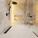 Calacatta Gold honed penny round marble mosaic shower floor