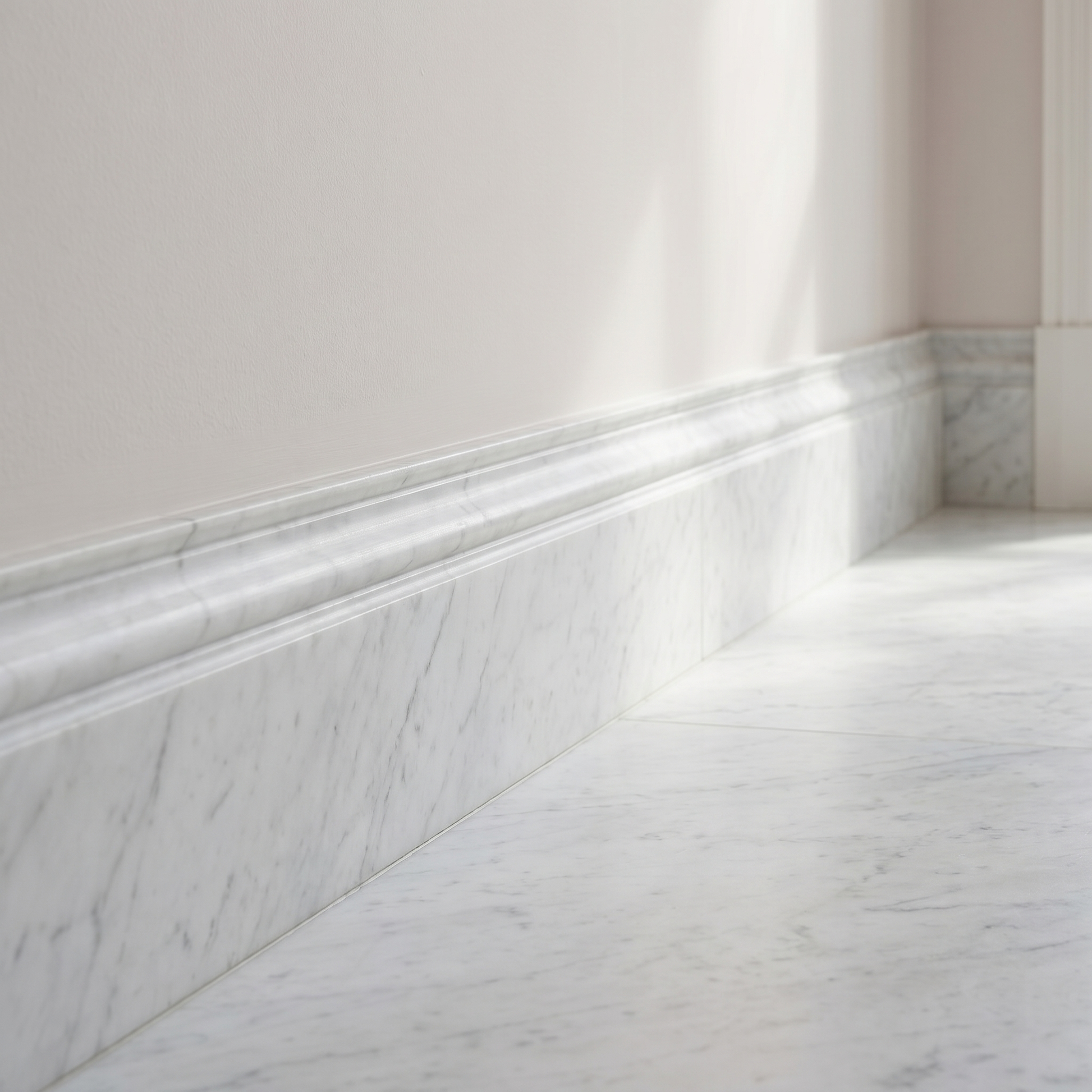 White Carrara honed marble base molding - hallway skirting