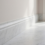 White Carrara honed marble base molding - hallway skirting